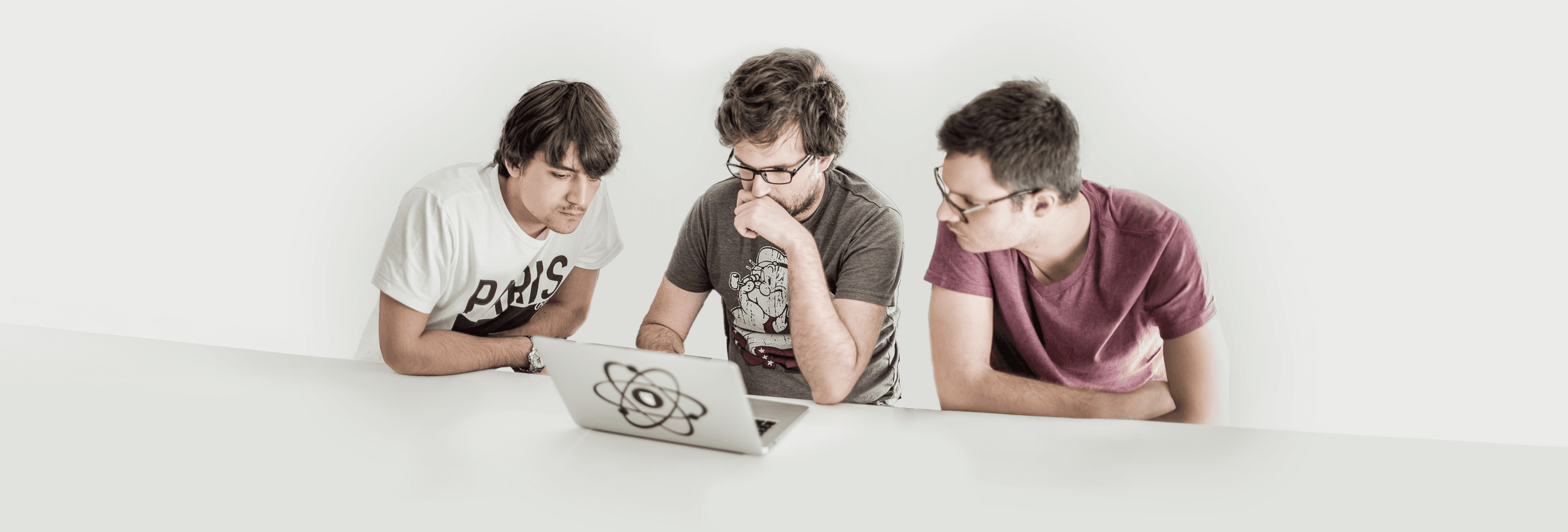 Engaged developers working on a laptop